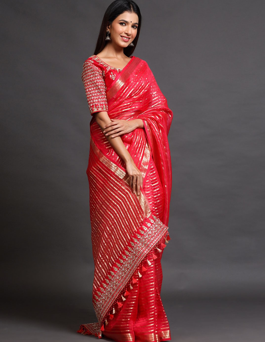 red saree with readymade red blouse