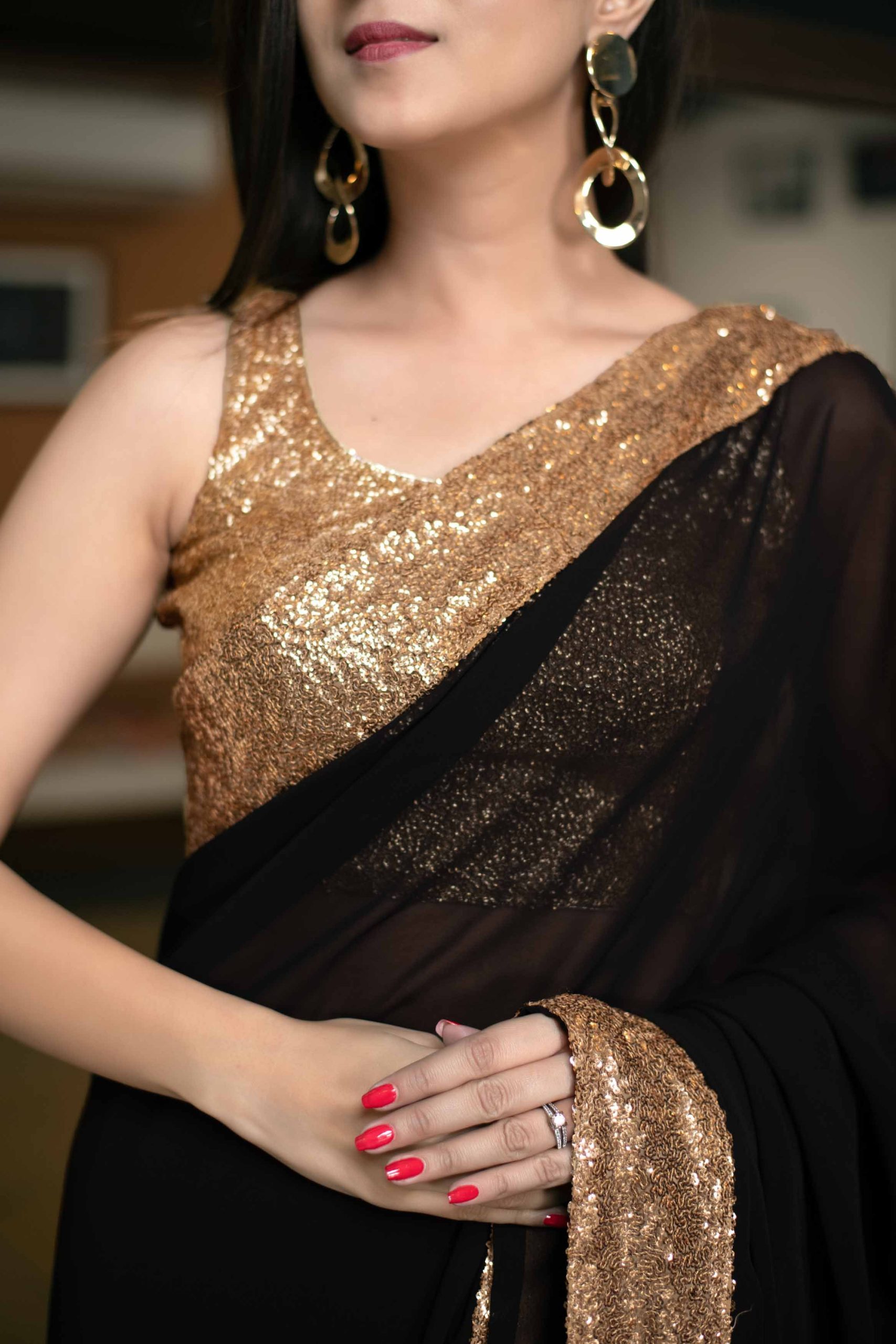 black saree with golden blouse